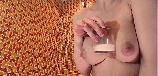  Cute mom milking her tits in glass, drink it, milking again and pour it on herself